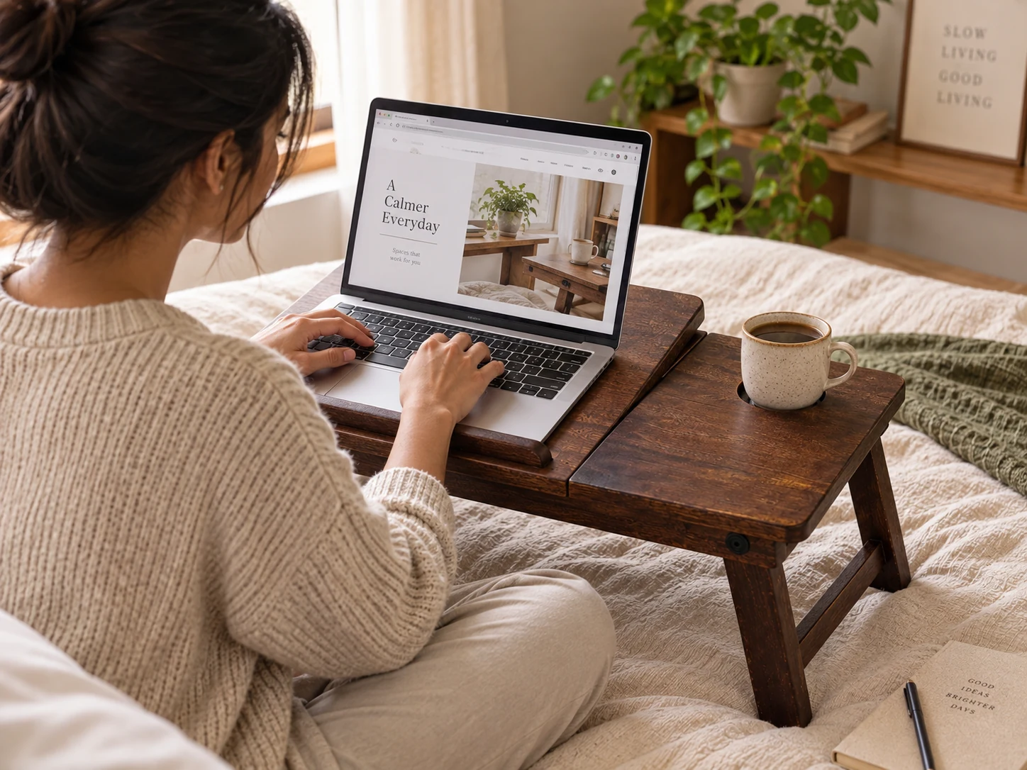 Wooden laptop table being used for working with a laptop
